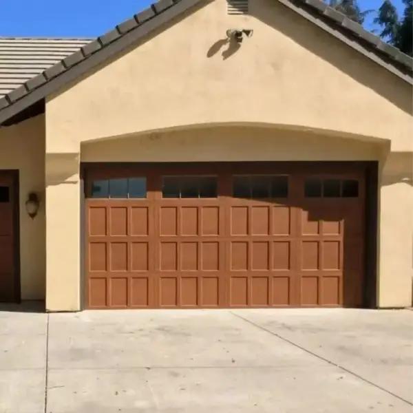 Brown raised-panel garage door installation