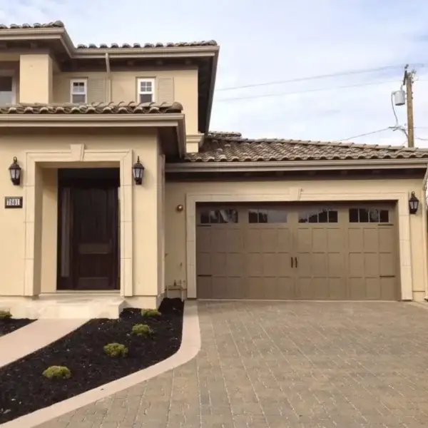 White carriage-style garage door installation